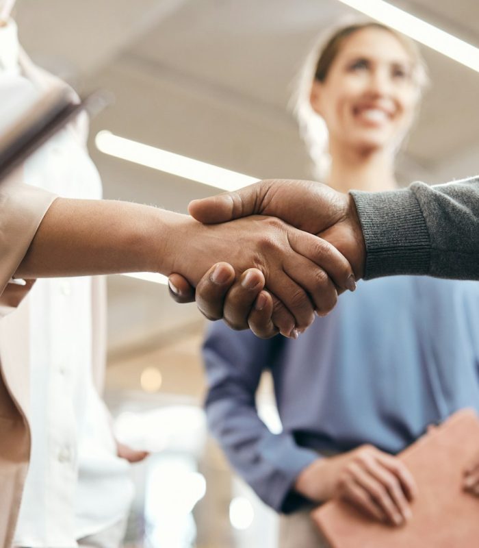 Close-up of busines partners handshaking after successful agreement in the office.